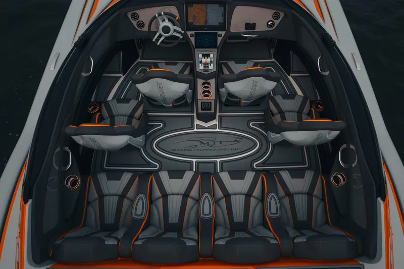 Slide: The Image of 2024 MTI 390X boat interior with sleek seating and advanced dashboard design. - 6