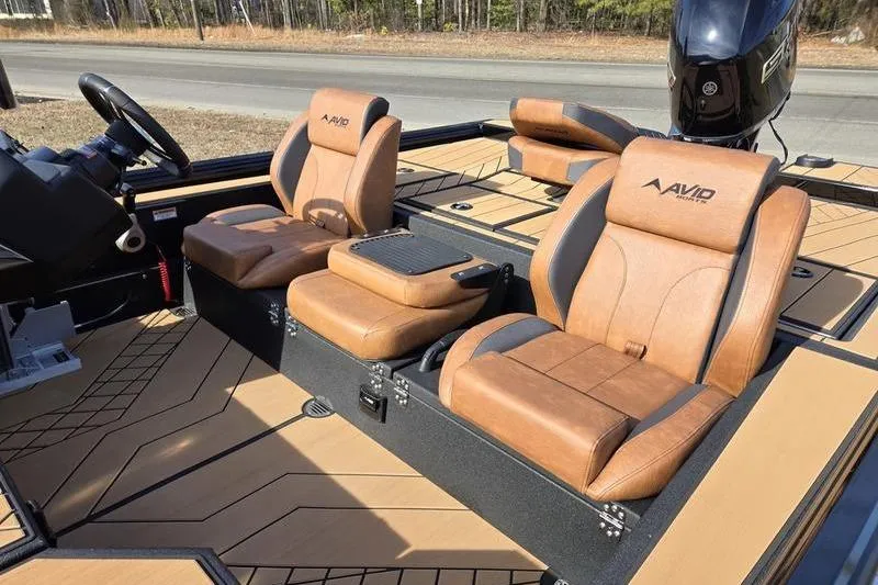 Slide: The Image of 2026 Avid 20 Vertex boat interior with tan leather seats and modern design. - 6