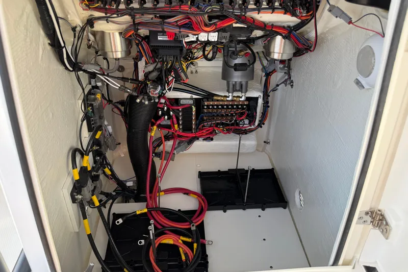Slide: The Image of Electrical wiring and components inside a 2026 Pathfinder 2200 TRS boat. - 28