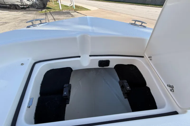 Slide: The Image of Open storage compartment on 2026 Pathfinder 2200 TRS boat, showcasing interior space. - 39