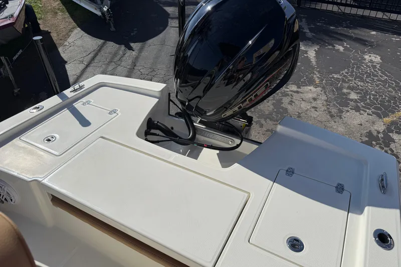 Slide: The Image of 2026 Pathfinder 2200 TRS boat with sleek outboard motor on display. - 8