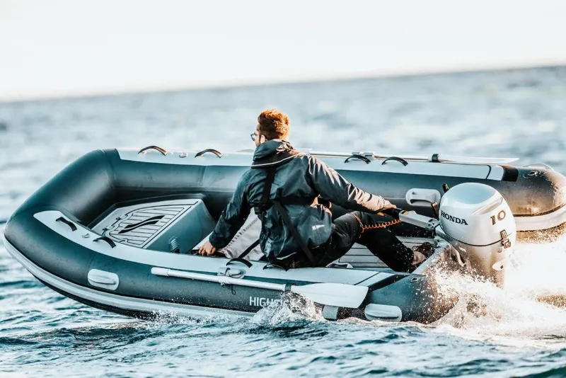 The Image of Man driving 2026 Highfield Classic 360 inflatable boat with Honda engine. - 0