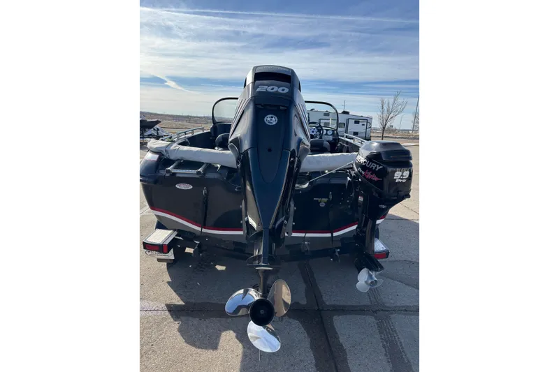 Slide: The Image of 2015 Nitro ZV18 boat with dual Mercury outboard motors, parked on a sunny day. - 3
