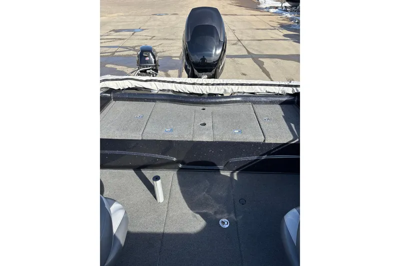 Slide: The Image of 2015 Nitro ZV18 boat interior with motor, showing deck and seating area. - 8