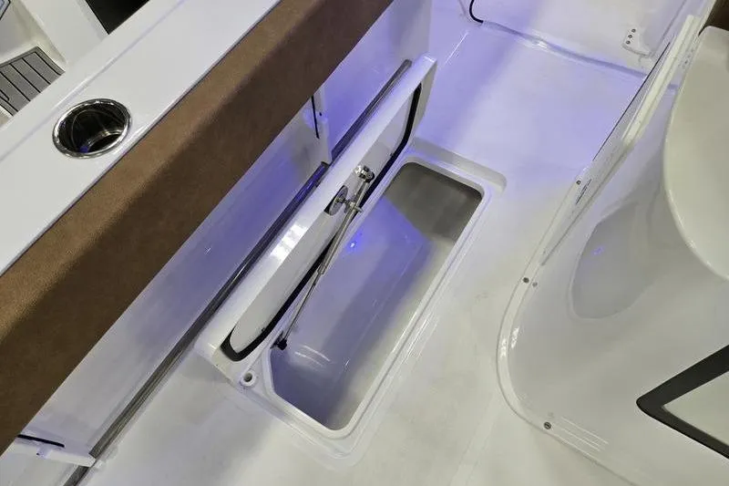 Slide: The Image of 2026 Sea Hunt Gamefish 27 Forward Seating boat interior with storage compartment. - 14