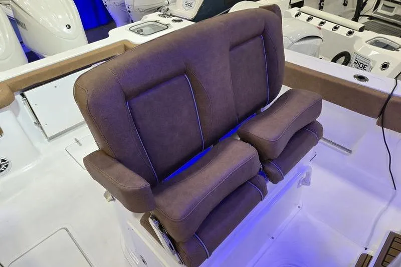 Slide: The Image of 2026 Sea Hunt Gamefish 27 Forward Seating with plush brown seats and modern design. - 17
