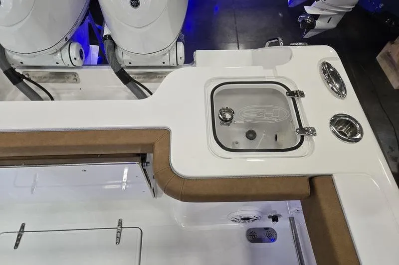 Slide: The Image of 2026 Sea Hunt Gamefish 27 boat interior with seating and storage features. - 5