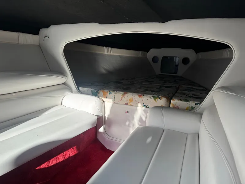Slide: The Image of Interior of a 1997 Baja 32 Outlaw boat with white upholstery. - 8