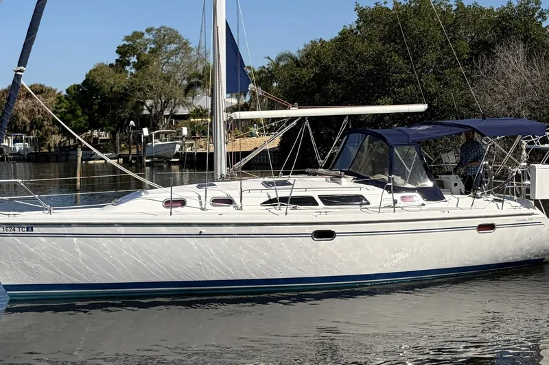 The Image of 2004 Catalina 36 MkII sailboat docked on a calm waterway. - 1