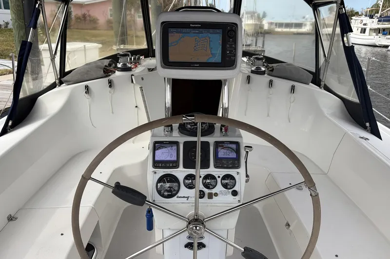 Slide: The Image of Cockpit of 2004 Catalina 36 MkII sailboat with navigation instruments and steering wheel. - 10