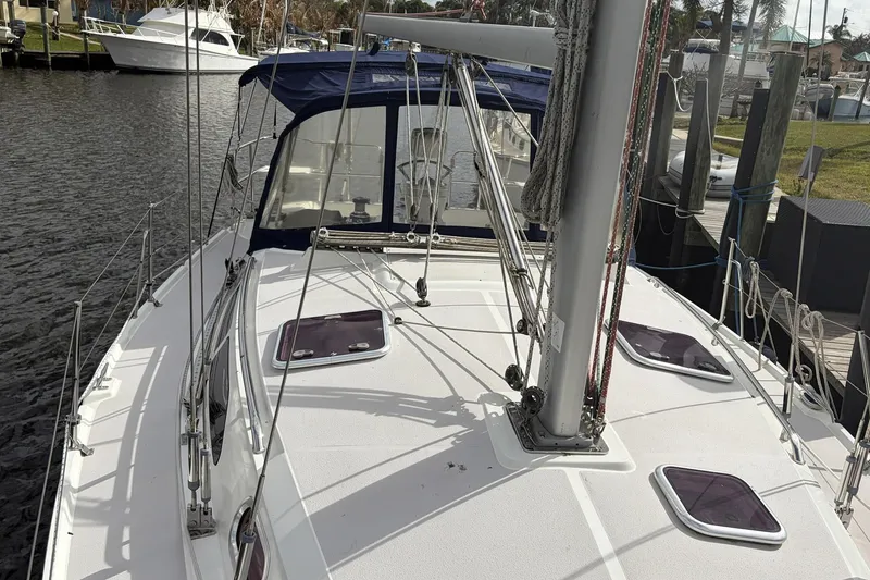 Slide: The Image of 2004 Catalina 36 MkII sailboat docked, showcasing deck and rigging details. - 16
