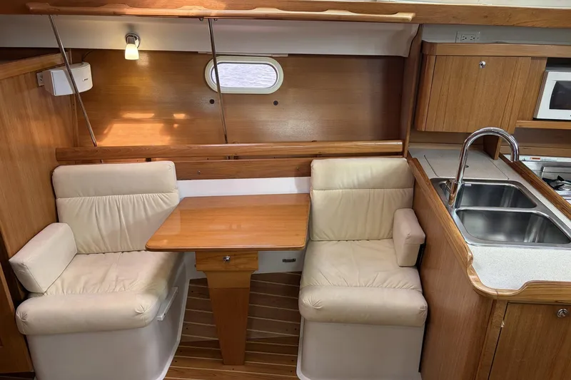 Slide: The Image of Interior of 2004 Catalina 36 MkII sailboat with dining area and kitchenette. - 20