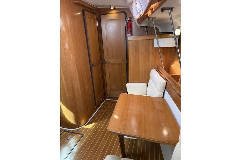 Slide: The Image of Interior of 2004 Catalina 36 MkII sailboat with wooden finishes and seating area. - 22