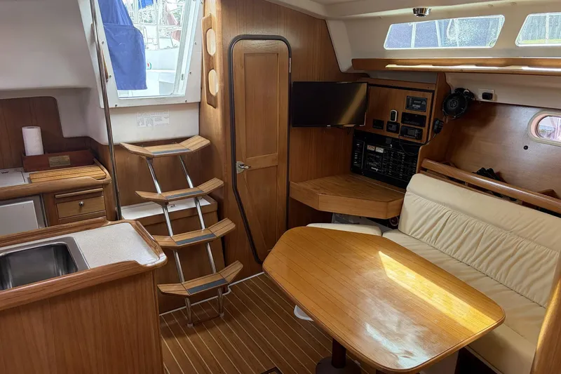 Slide: The Image of Interior of 2004 Catalina 36 MkII sailboat with wood finish and cozy seating area. - 26
