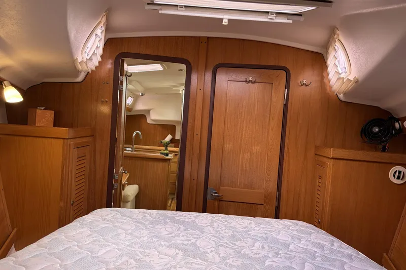 Slide: The Image of Interior of 2004 Catalina 36 MkII sailboat with wood paneling and cozy cabin. - 33