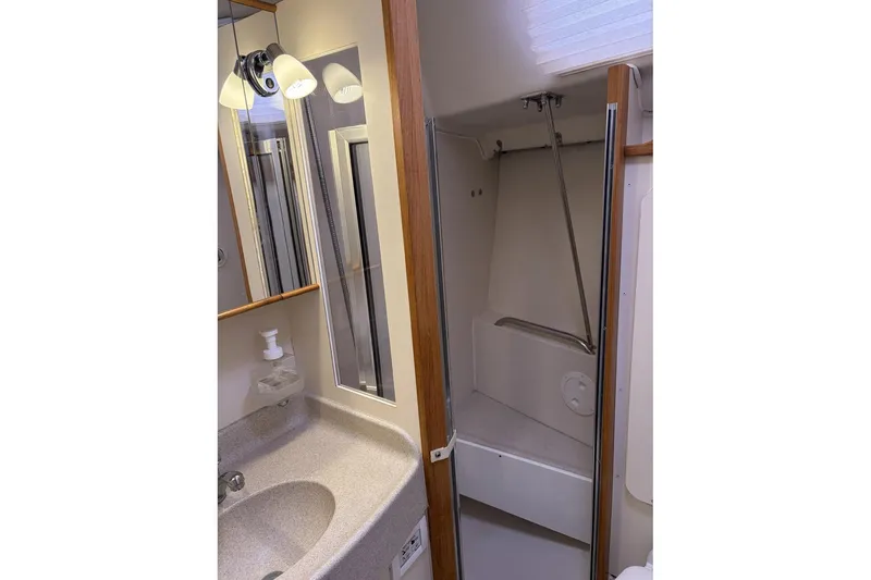 Slide: The Image of Bathroom interior of 2004 Catalina 36 MkII sailboat with sink and shower. - 34