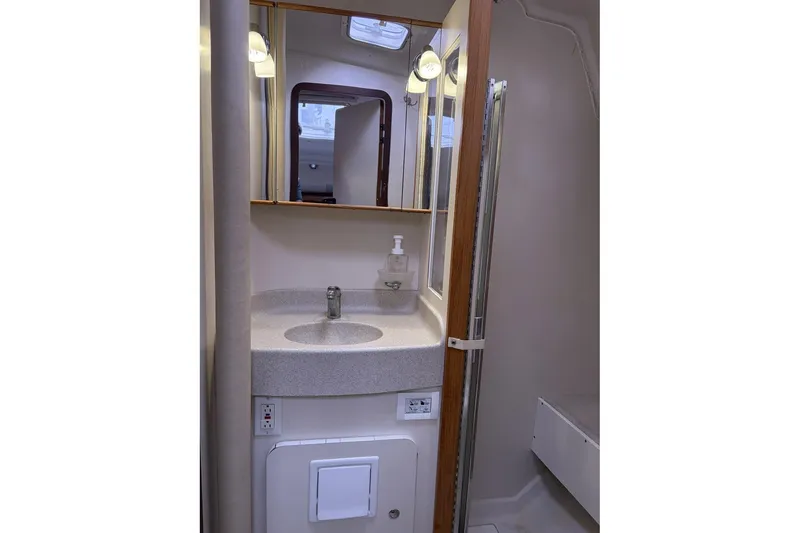 Slide: The Image of Bathroom interior of 2004 Catalina 36 MkII sailboat, featuring sink and mirror. - 36