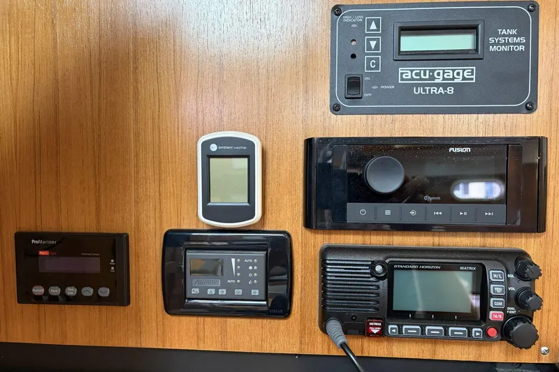 Slide: The Image of Control panel of a 2004 Catalina 36 MkII sailboat with various electronic devices. - 41