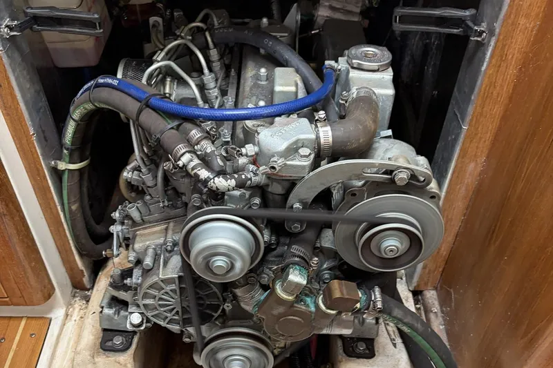 Slide: The Image of Engine of a 2004 Catalina 36 MkII sailboat, showcasing belts and hoses. - 42