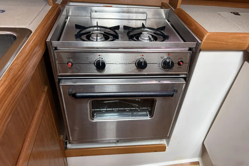Slide: The Image of Stainless steel stove and oven in 2004 Catalina 36 MkII yacht kitchen. - 43