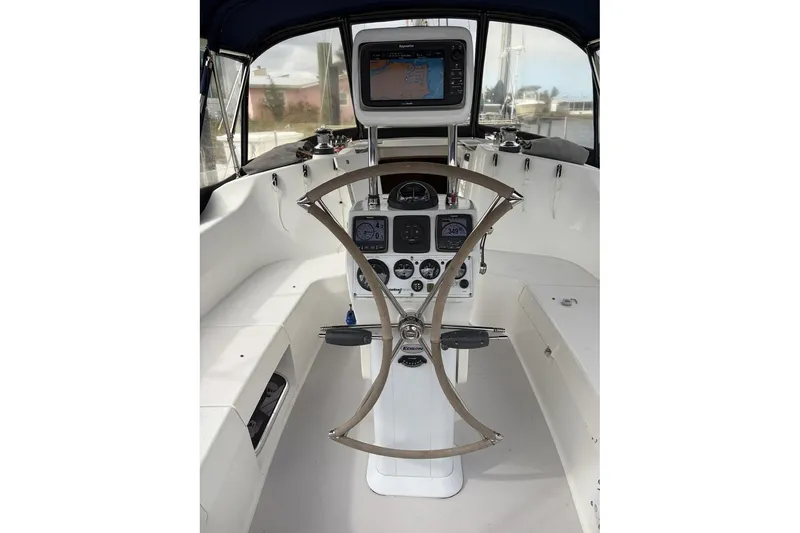 Slide: The Image of Cockpit of 2004 Catalina 36 MkII sailboat with navigation equipment and steering wheel. - 9