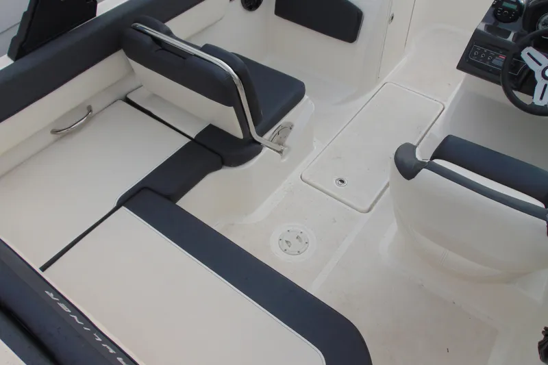 Slide: The Image of 2021 Bayliner VR5 Bowrider I/O interior with seating and steering wheel. - 10