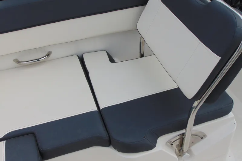 Slide: The Image of 2021 Bayliner VR5 Bowrider I/O boat seating with blue and white upholstery. - 12