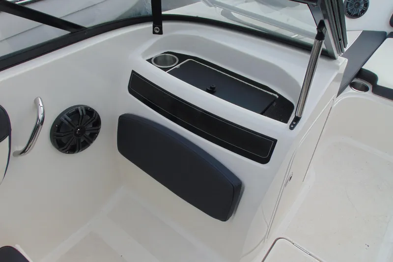 Slide: The Image of 2021 Bayliner VR5 Bowrider I/O interior with speaker and cup holder. - 14