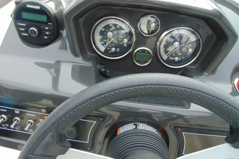 Slide: The Image of Dashboard of 2021 Bayliner VR5 Bowrider I/O with steering wheel and gauges. - 15