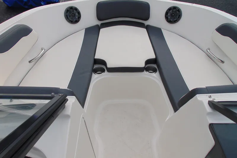 Slide: The Image of 2021 Bayliner VR5 Bowrider I/O boat interior with cushioned seating and cup holders. - 16