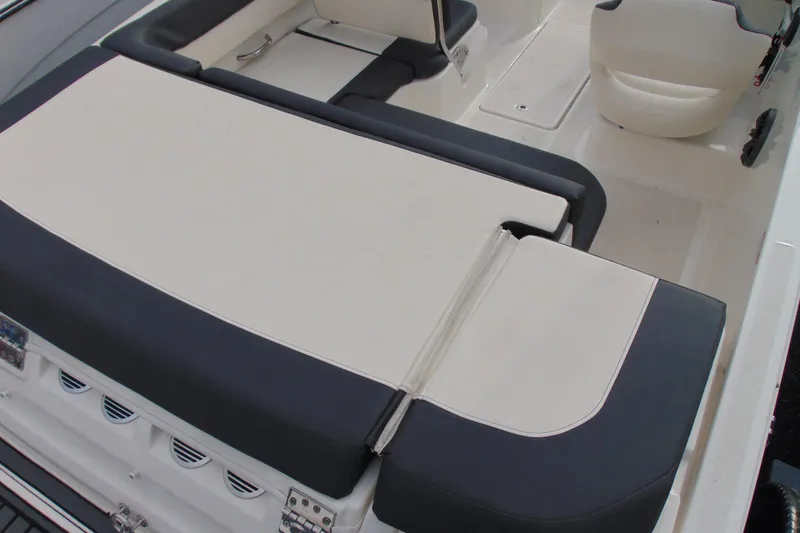 Slide: The Image of 2021 Bayliner VR5 Bowrider I/O interior with cushioned seating and modern design. - 7