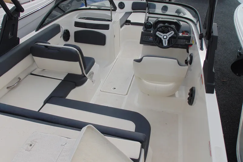 Slide: The Image of 2021 Bayliner VR5 Bowrider I/O interior with sleek seating and modern dashboard design. - 9