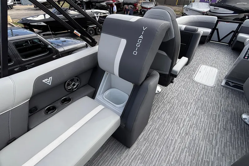 Slide: The Image of 2026 Viaggio X24U boat interior with gray seating, cup holders, and modern design. - 19