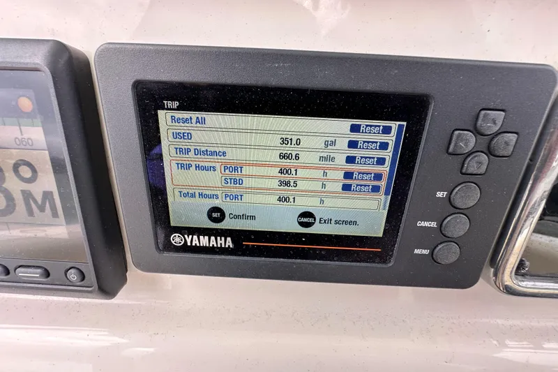 Slide: The Image of Yamaha display on 2016 Cobia 277 Center Console showing trip data and fuel usage. - 12