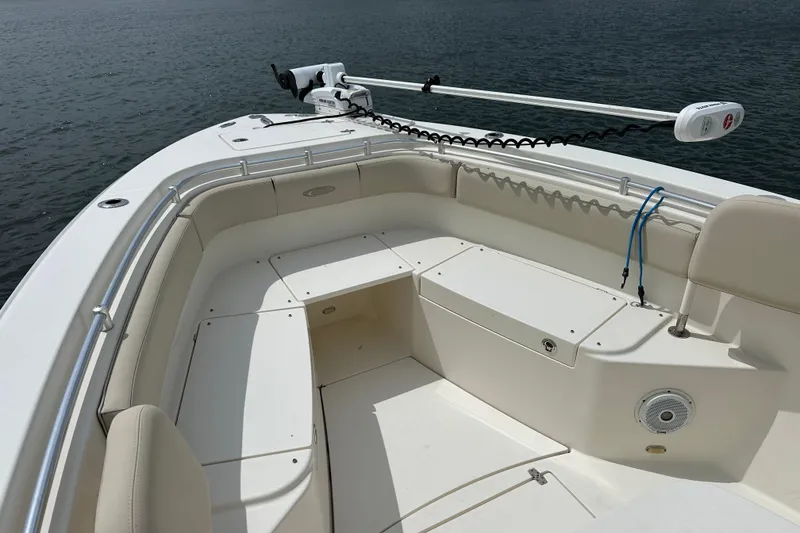 Slide: The Image of 2016 Cobia 277 Center Console boat with spacious seating and trolling motor. - 7