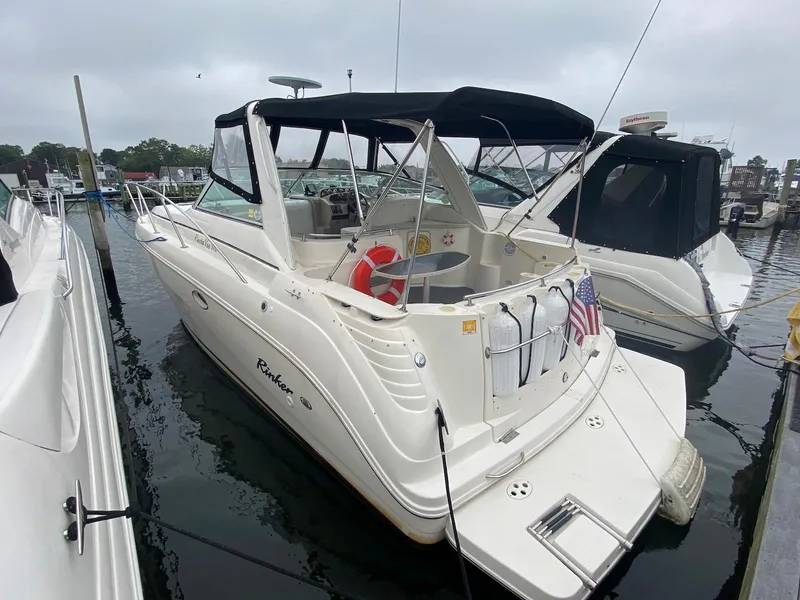The Image of Rinker Fiesta Vee 310 boat, year 2000, docked at marina. - 0