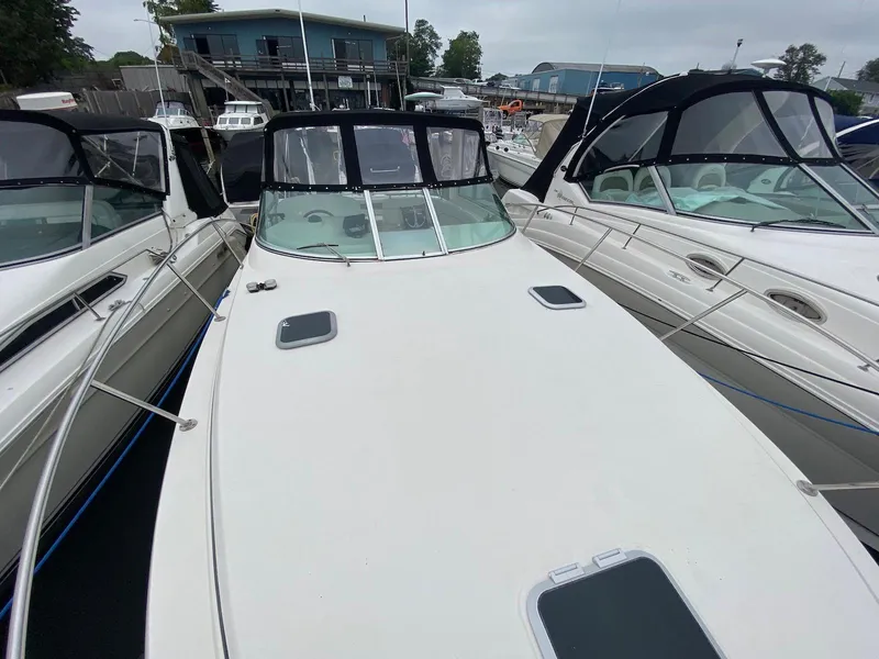 Slide: The Image of Rinker Fiesta Vee 310 boat, year 2000, docked at marina. - 14