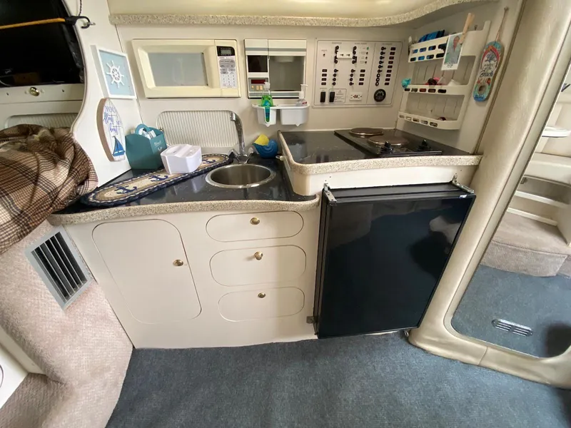 Slide: The Image of 2000 Rinker Fiesta Vee 310 boat kitchen interior view. - 20