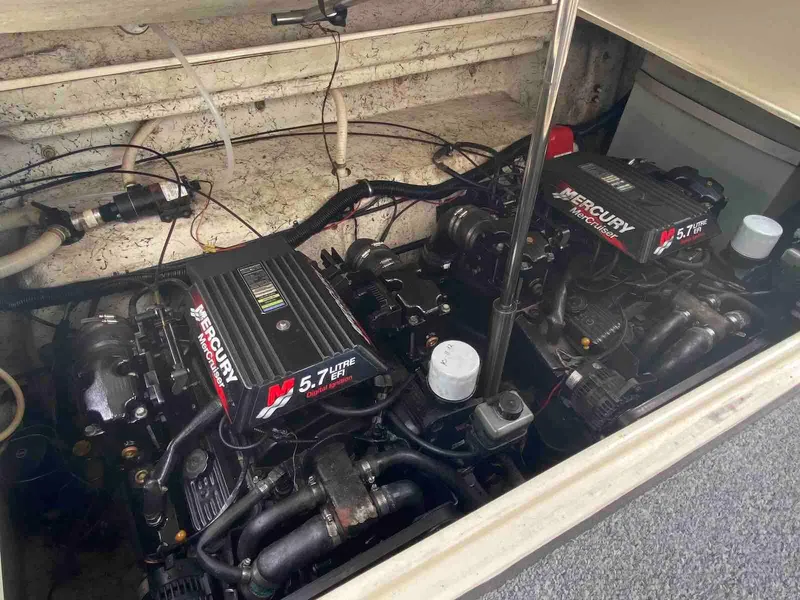 Slide: The Image of Dual Mercury engines in a 2000 Rinker Fiesta Vee 310. - 22