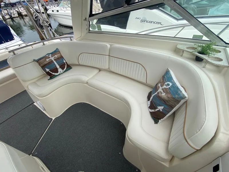 Slide: The Image of Interior of a 2000 Rinker Fiesta Vee 310 boat with white seating. - 6