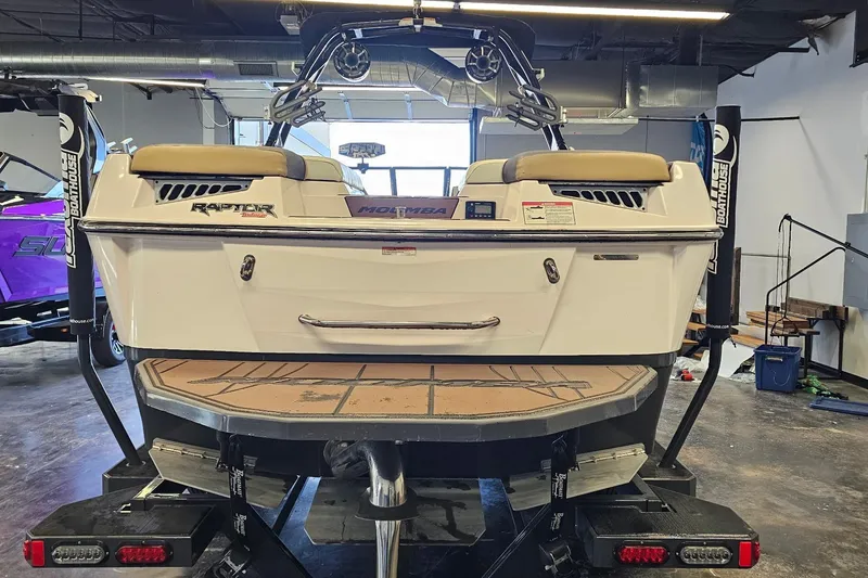Slide: The Image of 2019 Moomba Makai boat on trailer in indoor showroom. - 14