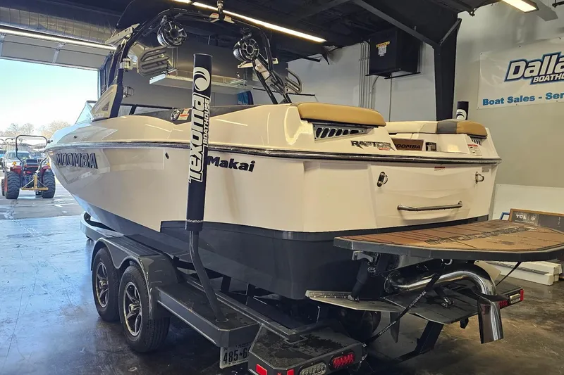 Slide: The Image of 2019 Moomba Makai boat on trailer in showroom, featuring Texoma branding. - 15