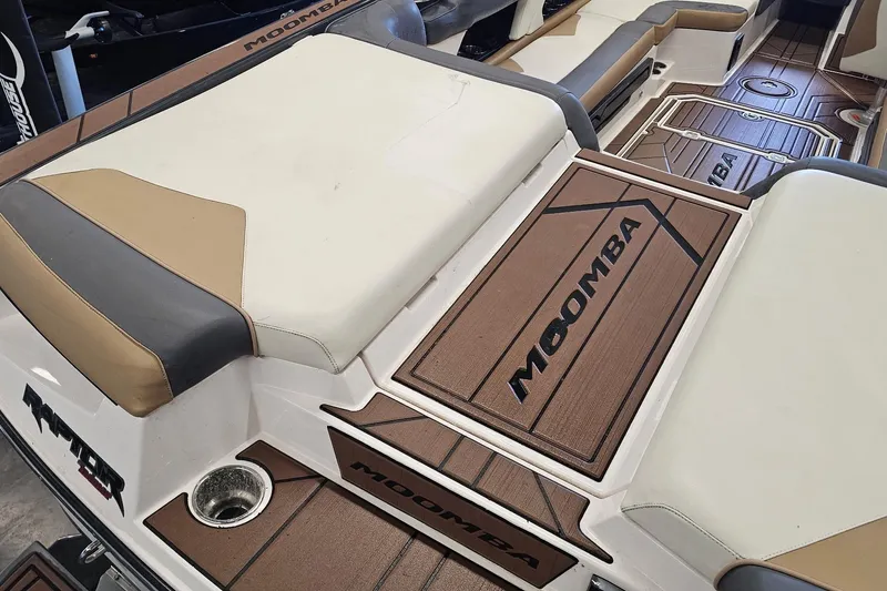 Slide: The Image of 2019 Moomba Makai boat interior with cushioned seating and branded flooring. - 17