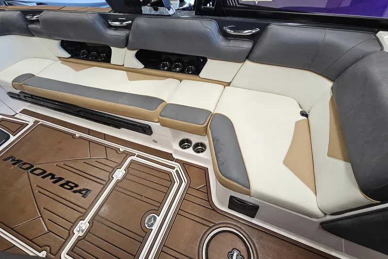Slide: The Image of 2019 Moomba Makai boat interior with cushioned seating and branded flooring. - 20