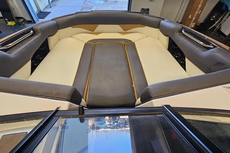 Slide: The Image of 2019 Moomba Makai boat interior with cushioned seating and sleek design. - 23