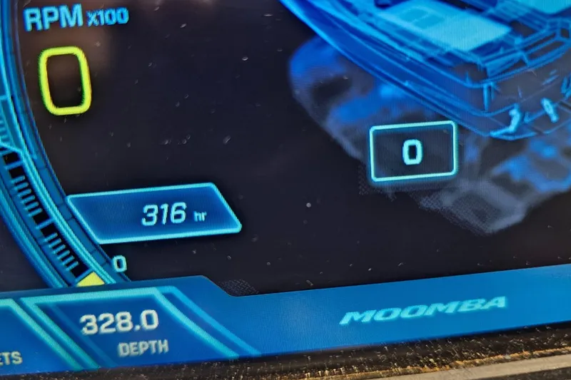Slide: The Image of Dashboard display of a 2019 Moomba Makai boat showing RPM, hours, and depth. - 24