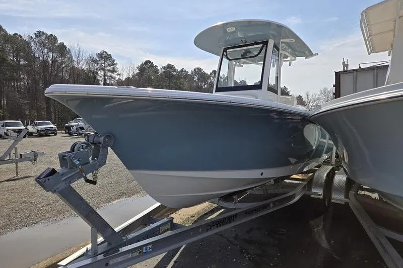 Slide: The Image of 2023 Sea Hunt Ultra 239 SE boat on trailer, parked outdoors. - 3