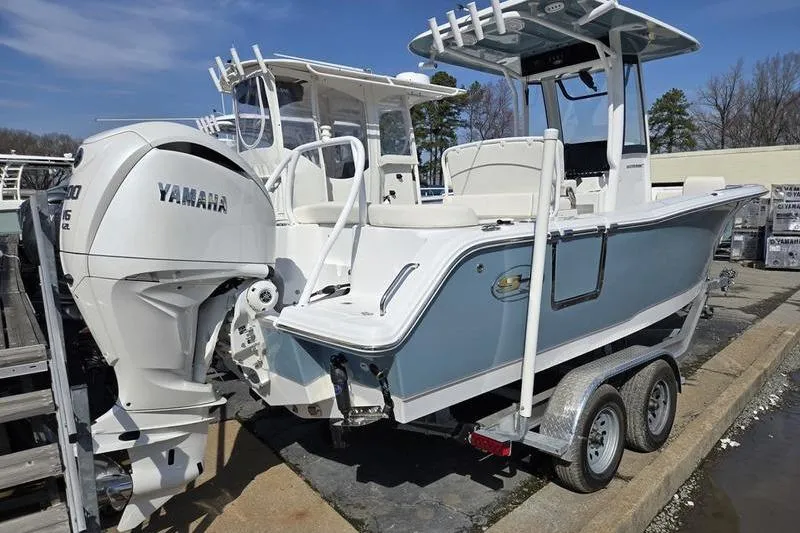 Slide: The Image of 2023 Sea Hunt Ultra 239 SE boat on trailer with Yamaha engine. - 4