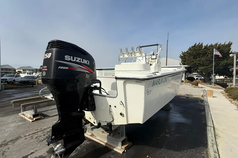 Slide: The Image of 1995 Marlin 210 boat with Suzuki 250 outboard motor on display. - 3