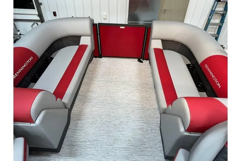Slide: The Image of 2026 Bennington 22 SSR Quad Bench interior with red and gray seating, in stock. - 18